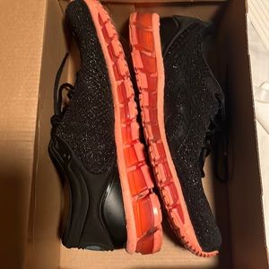 Woman’s tennis shoe gently worn